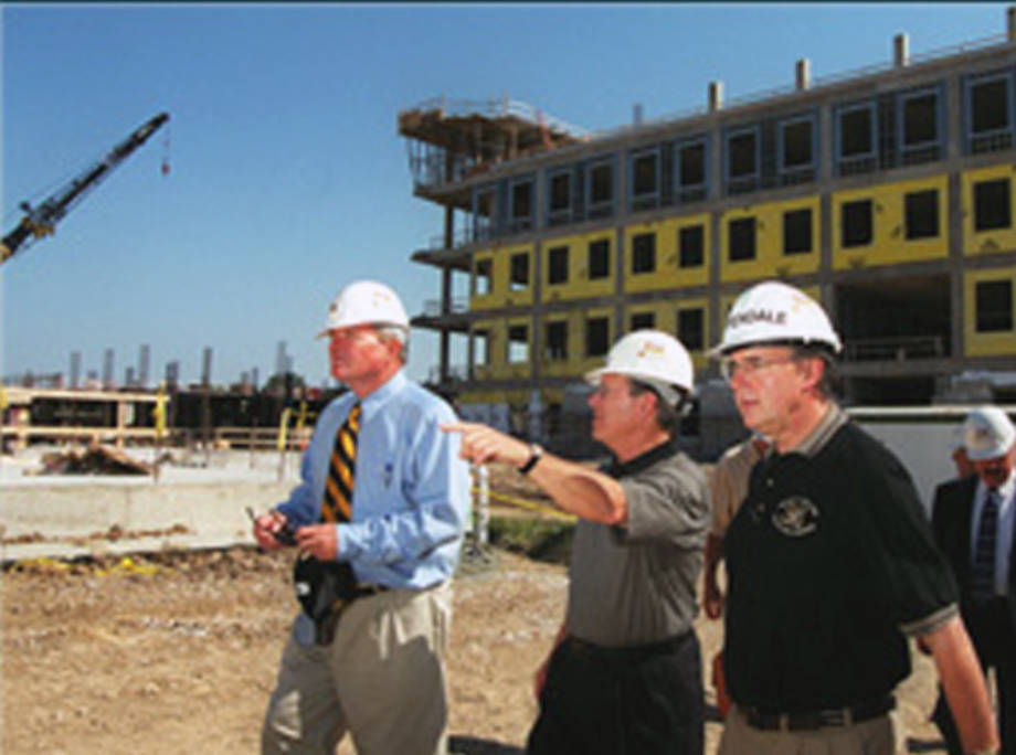 CAFNR Dean Tom Payne surveys the construction of the Christopher S. Bond Life Sciences Center in the early 2000s. To his right is Mike Chippendale, the center's first director. 
