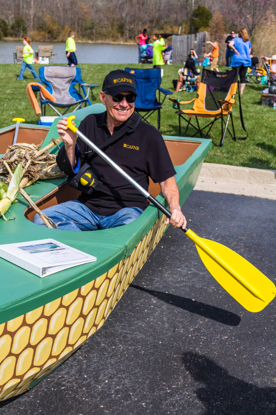 CAFNR Dean Tom Payne shows off CAFNR's submission, a corn-themed vessel, in the 2014 edition of the Float Your Boat for the Food Bank event at Bass Pro Shops Lake. Photo by Aaron Duke. 