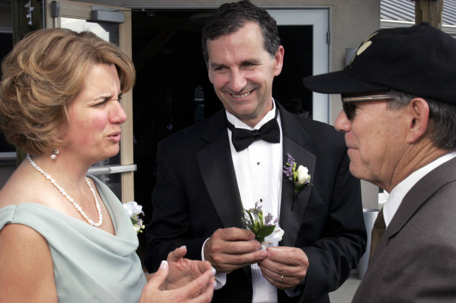 John Gardner and his wife, Julie, talk with Dean Payne at the wedding of THEIR DAUGHTER KATE IN YEAR. Photo courtesy of John Gardner. 
