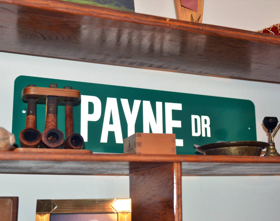 A replica of the sign of Payne Drive near the Ohio Agricultural Research and Development Center in Wooster, Ohio, sits in CAFNR Dean Tom Payne's home office. Photo by Stephen Schmidt.