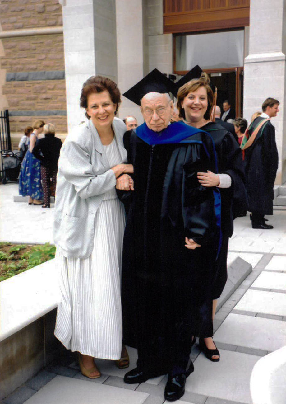 Carolyn Wenneker, left, Homer Patrick, and Robin Wenneker pose for a photo on Robin's graduation from her MBA program at Washington University in St. Louis in 2002. Patrick wore an old graduation gown of his for the occasion. Photo courtesy of Robin Wenneker.