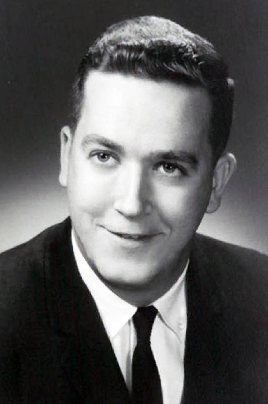 Ron Wenneker, in his early 20s. This is believed to be one of the first professional photos that he had taken after becoming an insurance agent. Photo courtesy of Robin Wenneker.