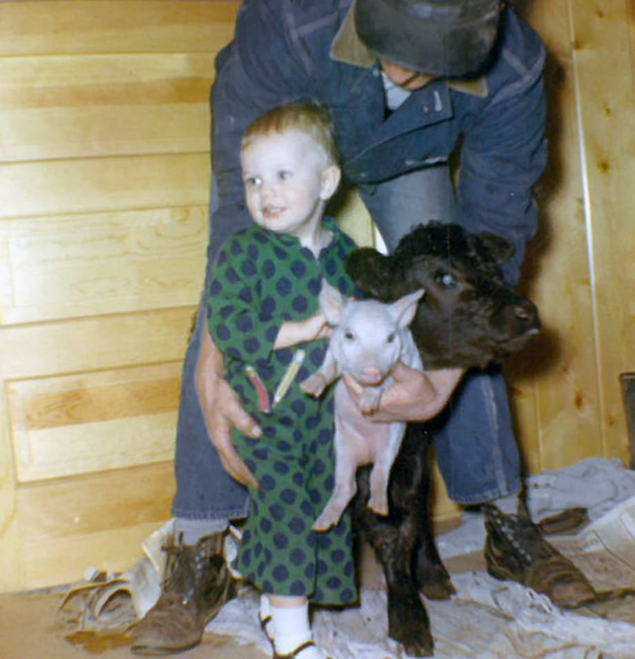 A 2-year-old Robin with a pig and a calf. Robin spent her childhood helping take care of animals on the weekends at her family's farms. Photo courtesy of Robin Wenneker.