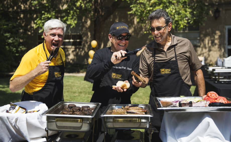 The three CAFNR deans (Bryan Garton, Tom Payne and Marc Linit) have a little fun while serving food at a faculty/staff appreciation lunch event last year. 