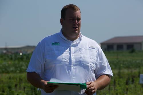 Graduate student Eric Oseland presents his research during the Pest Management field day in July.
